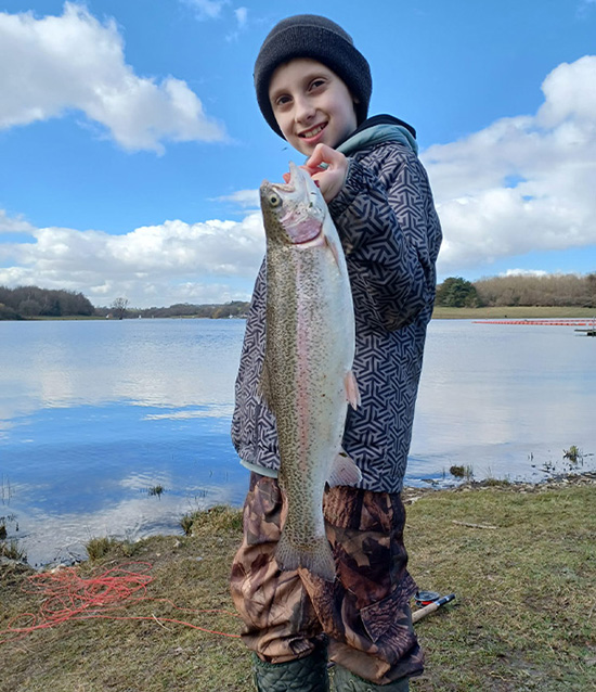 Child holding a fish