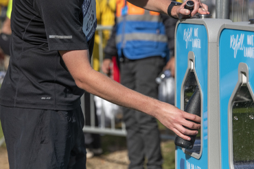 Runner filling up a bottle at a wessex water refill point