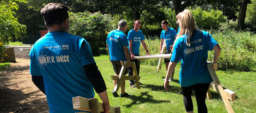 Water Force volunteers building a bench