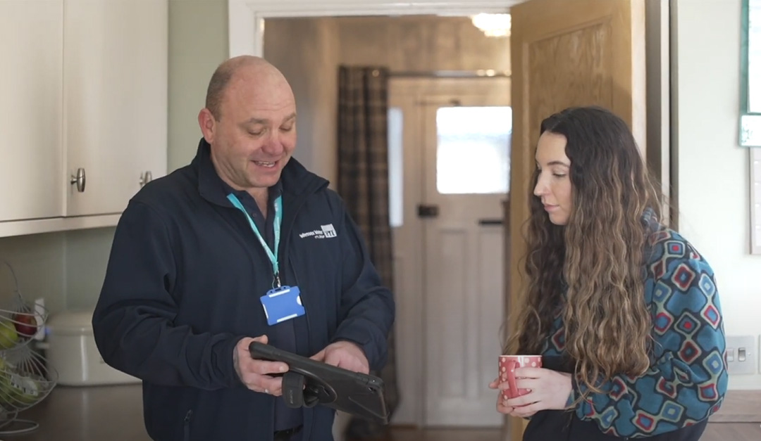 Home check employee talking to a customer