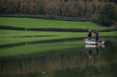 Anglers In A Boat Fishing