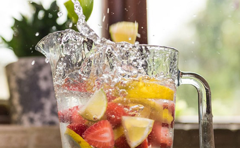 Water mixed with fruit in a glass jar