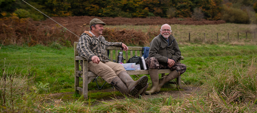 Visitors Talking On A Bench at our recreation site